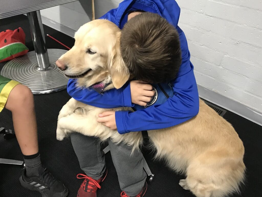 Boy Embracing Pet Dog